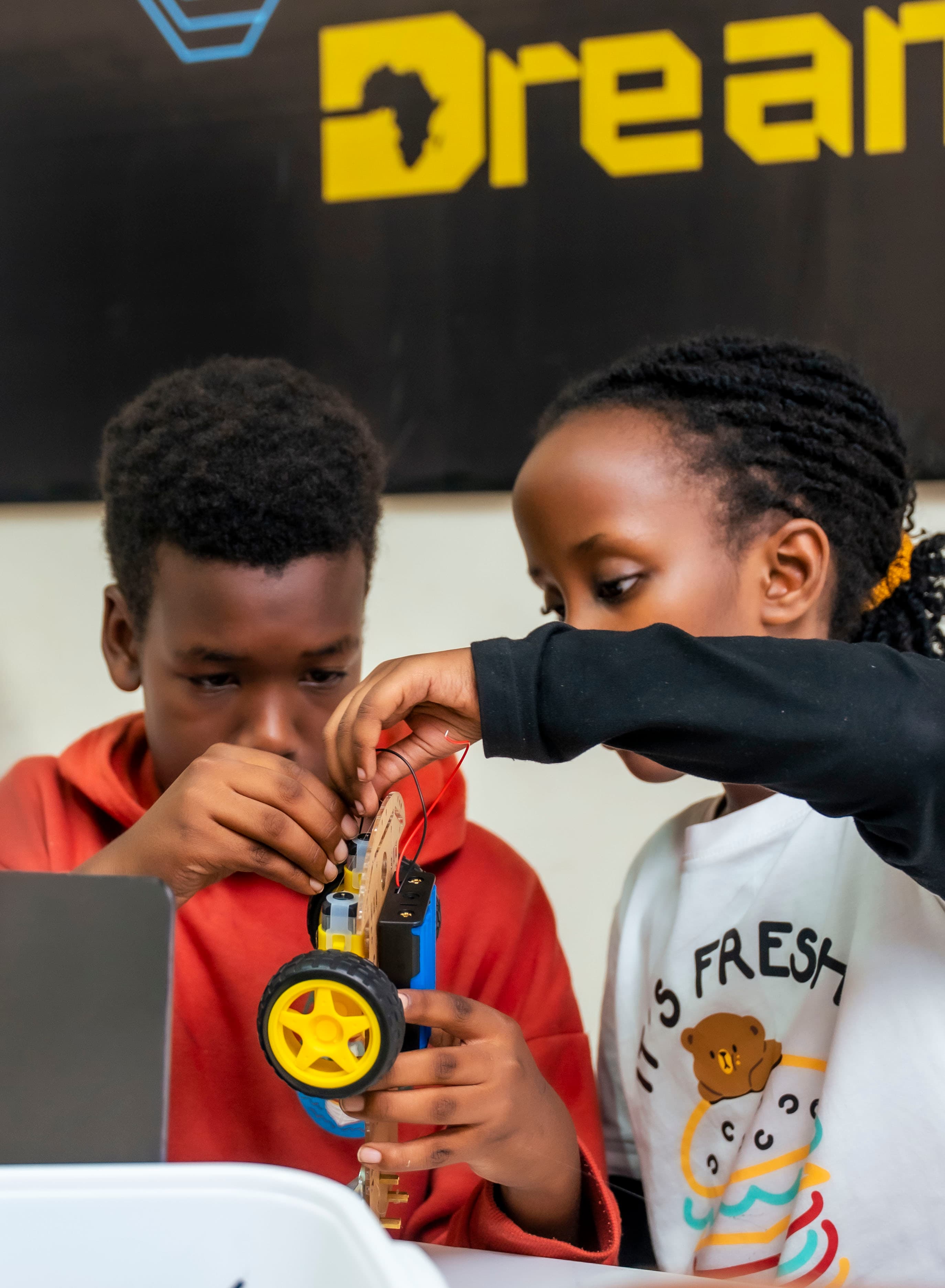 Joyful child in a tech learning environment